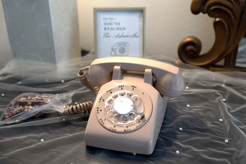A rotary telephone left out for messages to the couple