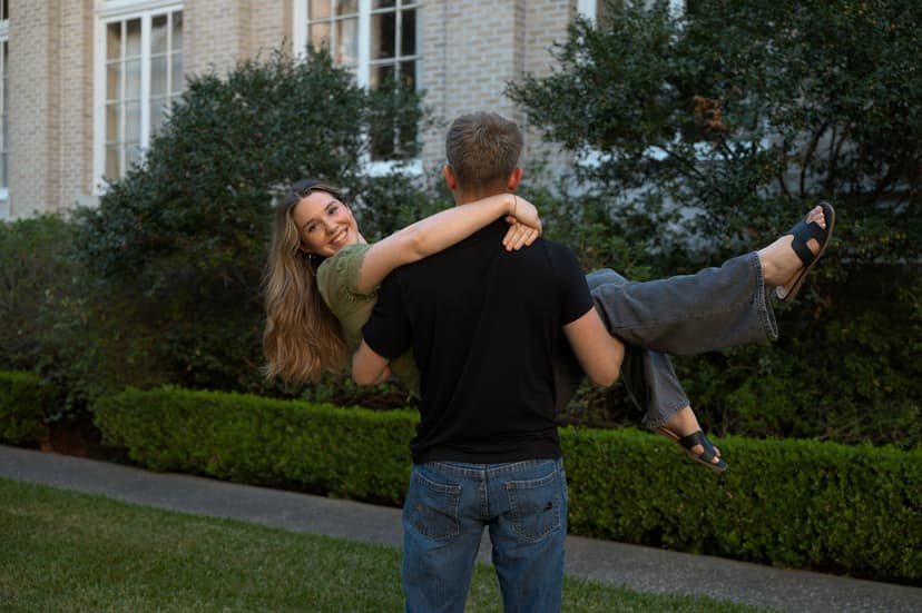 Guy holding girl